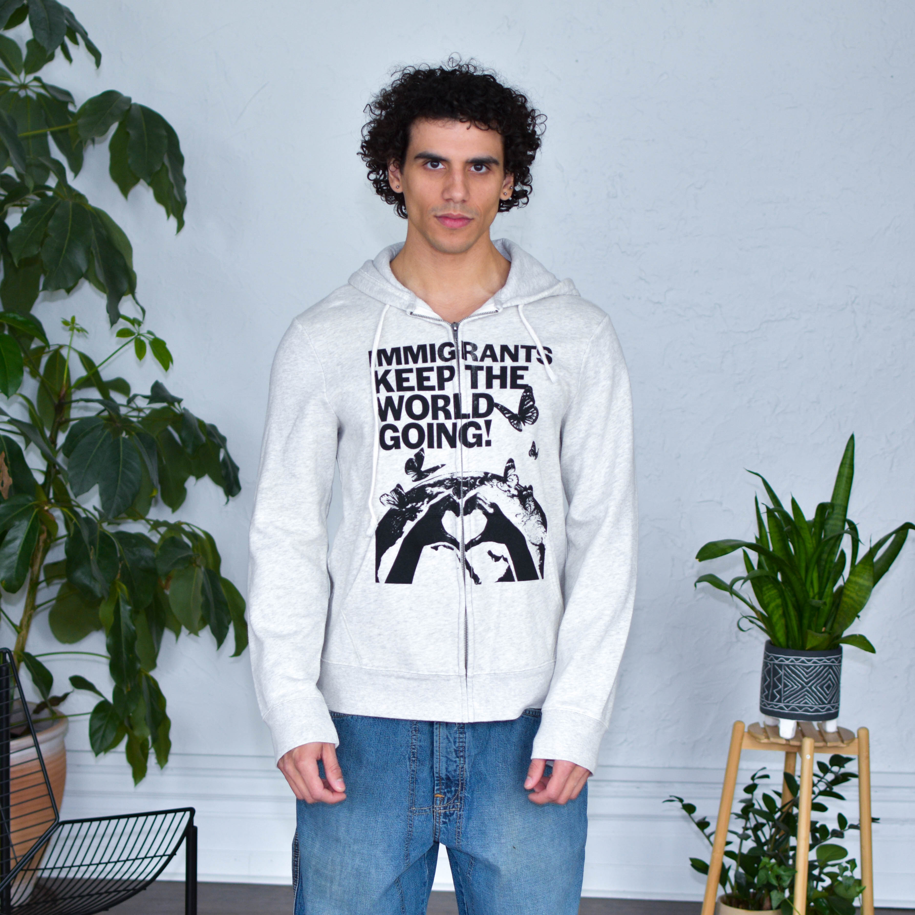 Gray Zip-Up Sweatshirt "Immigrants Keep the World Going" Solidarity Merch