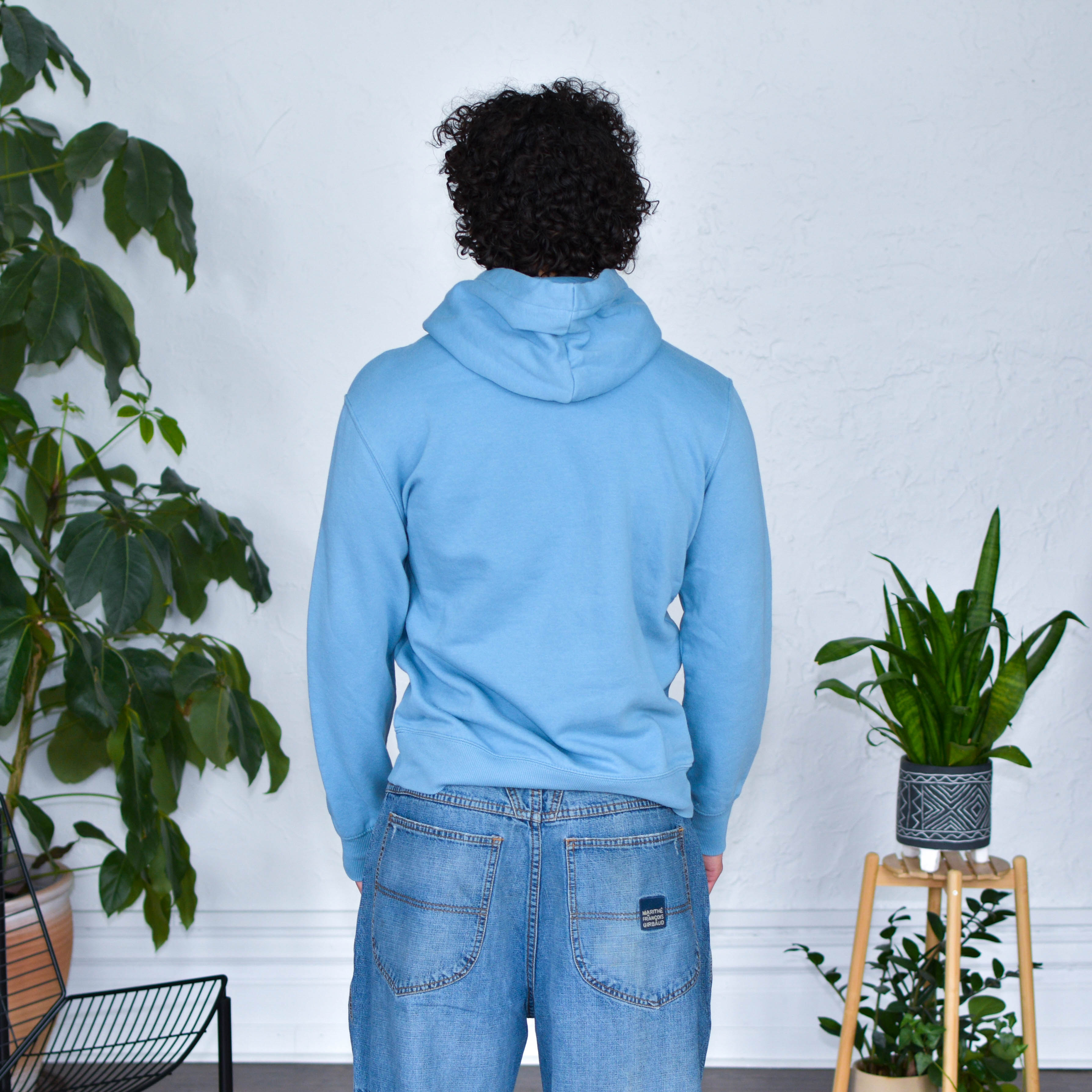 Light Blue Hoodie "Immigrants Keep the World Going" Solidarity Merch