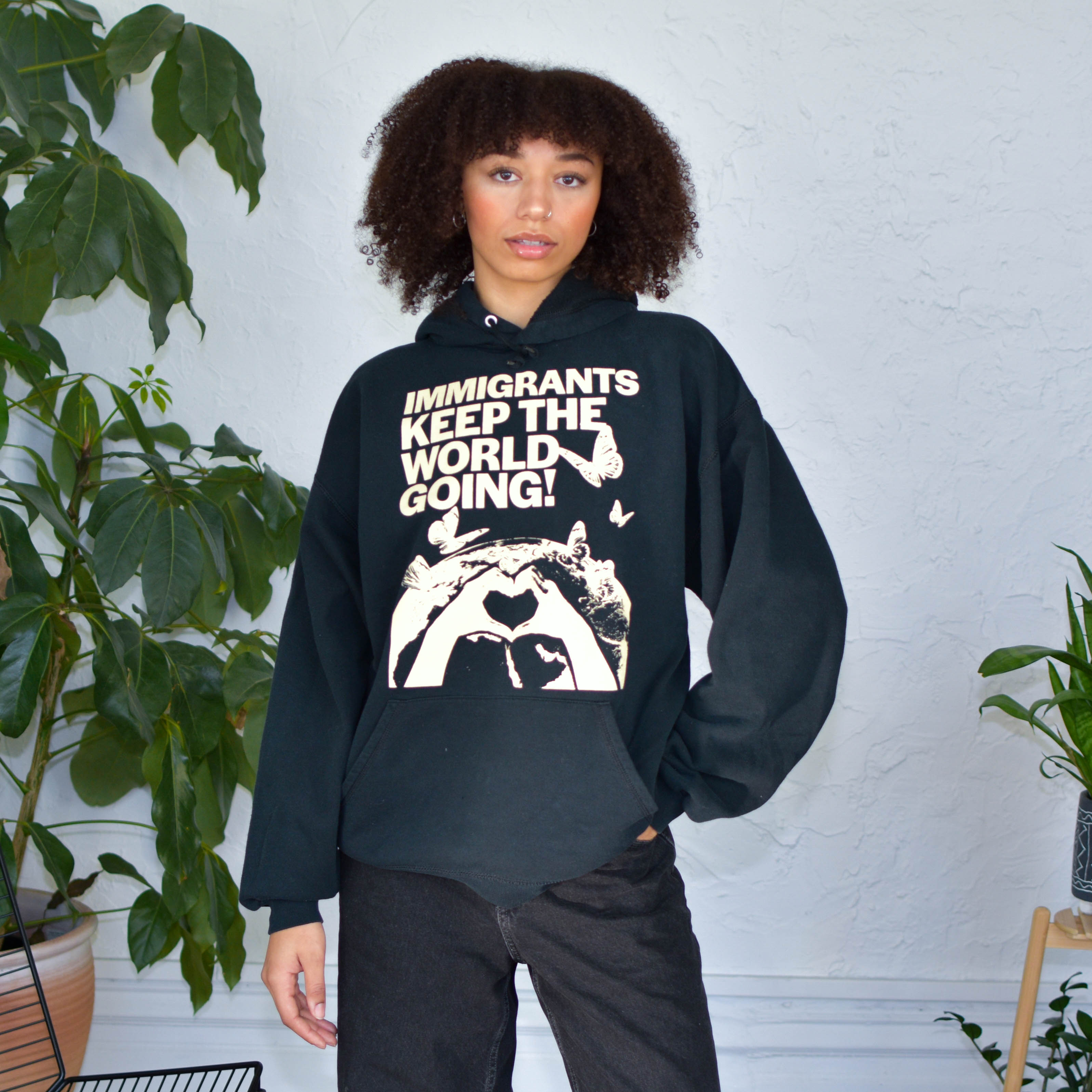 Black Sweatshirt - "Immigrants Keep the World Going" Solidarity Merch