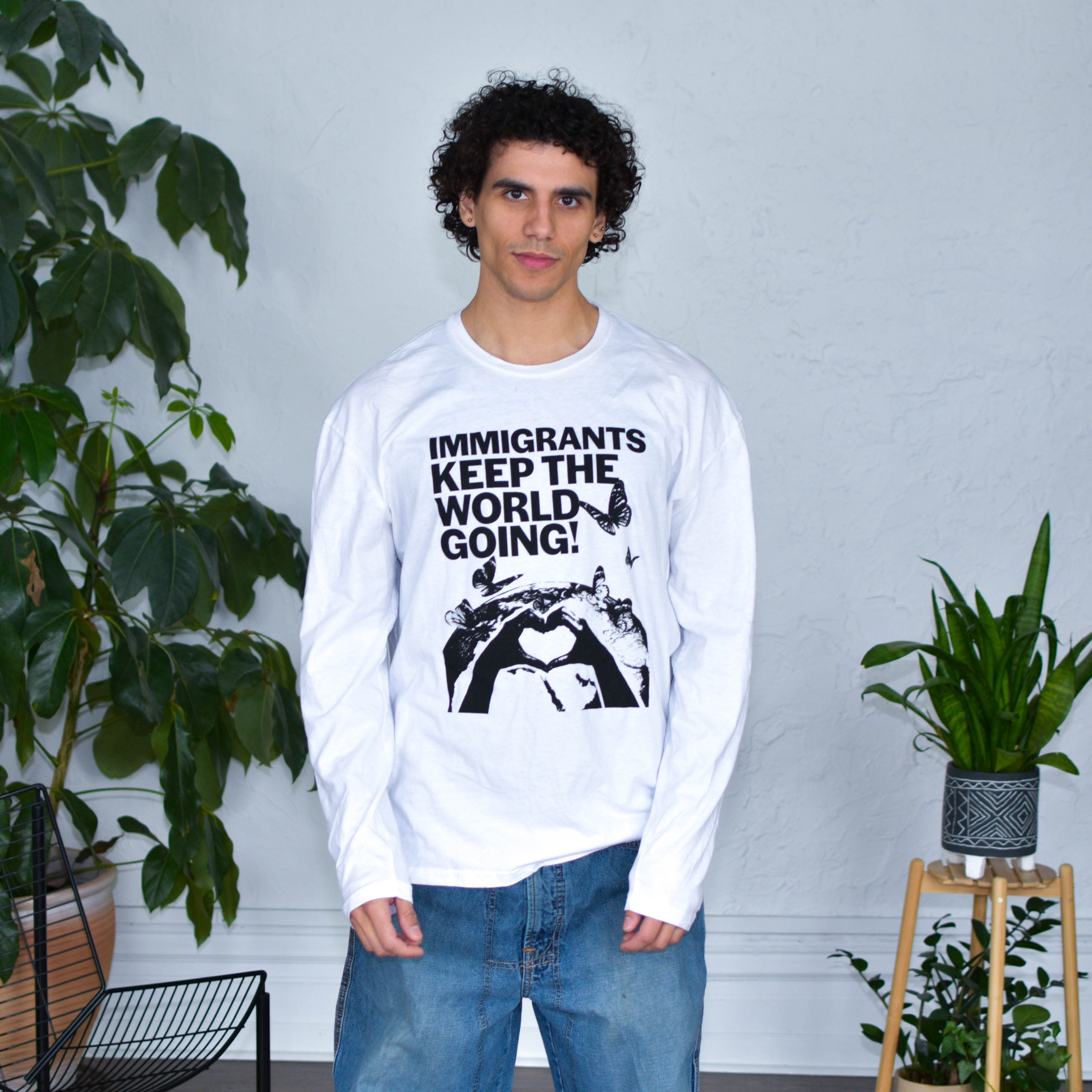 White Long Sleeve Shirt - "Immigrants Keep the World Going" Solidarity Merch