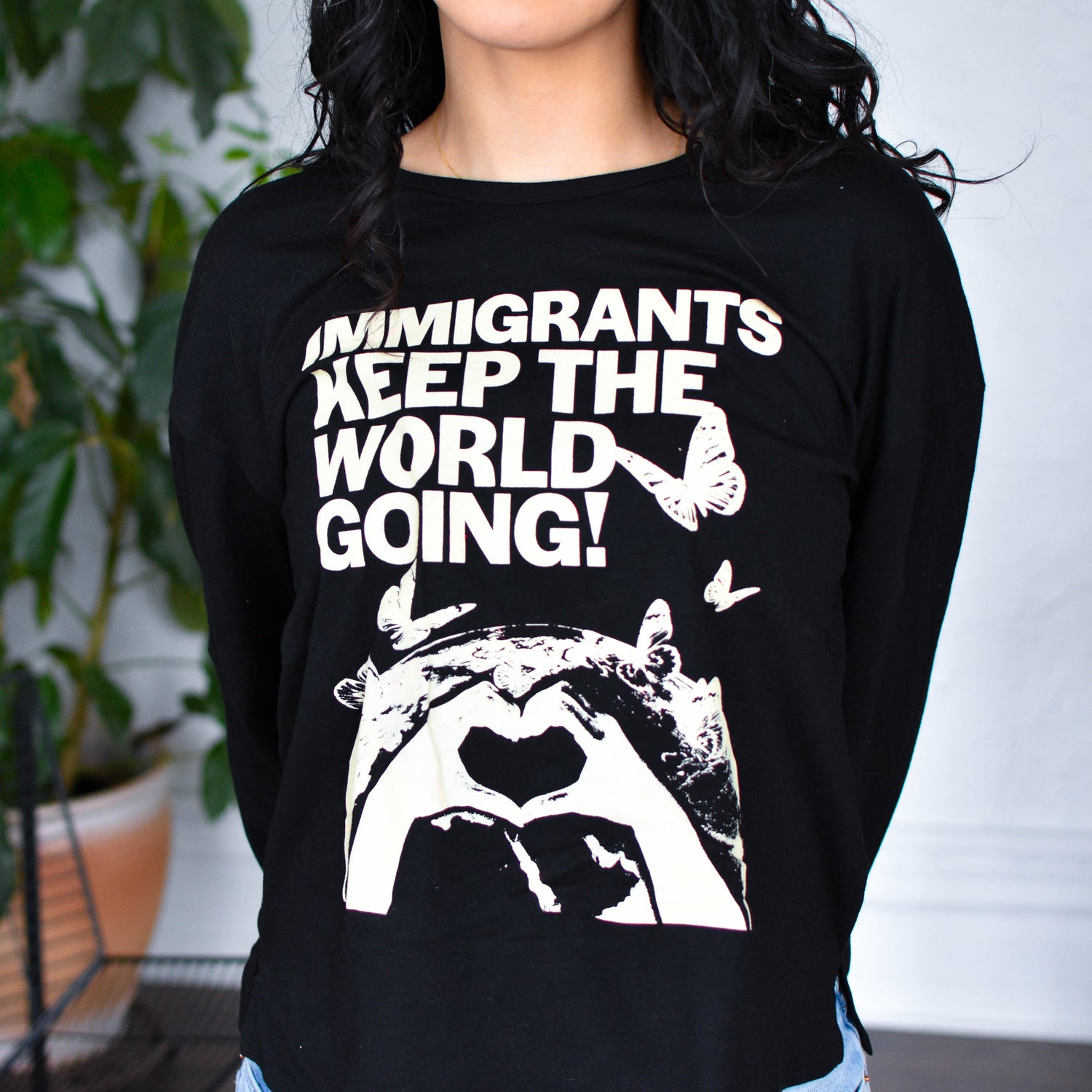 Black Long Sleeve Shirt - "Immigrants Keep the World Going" Solidarity Merch