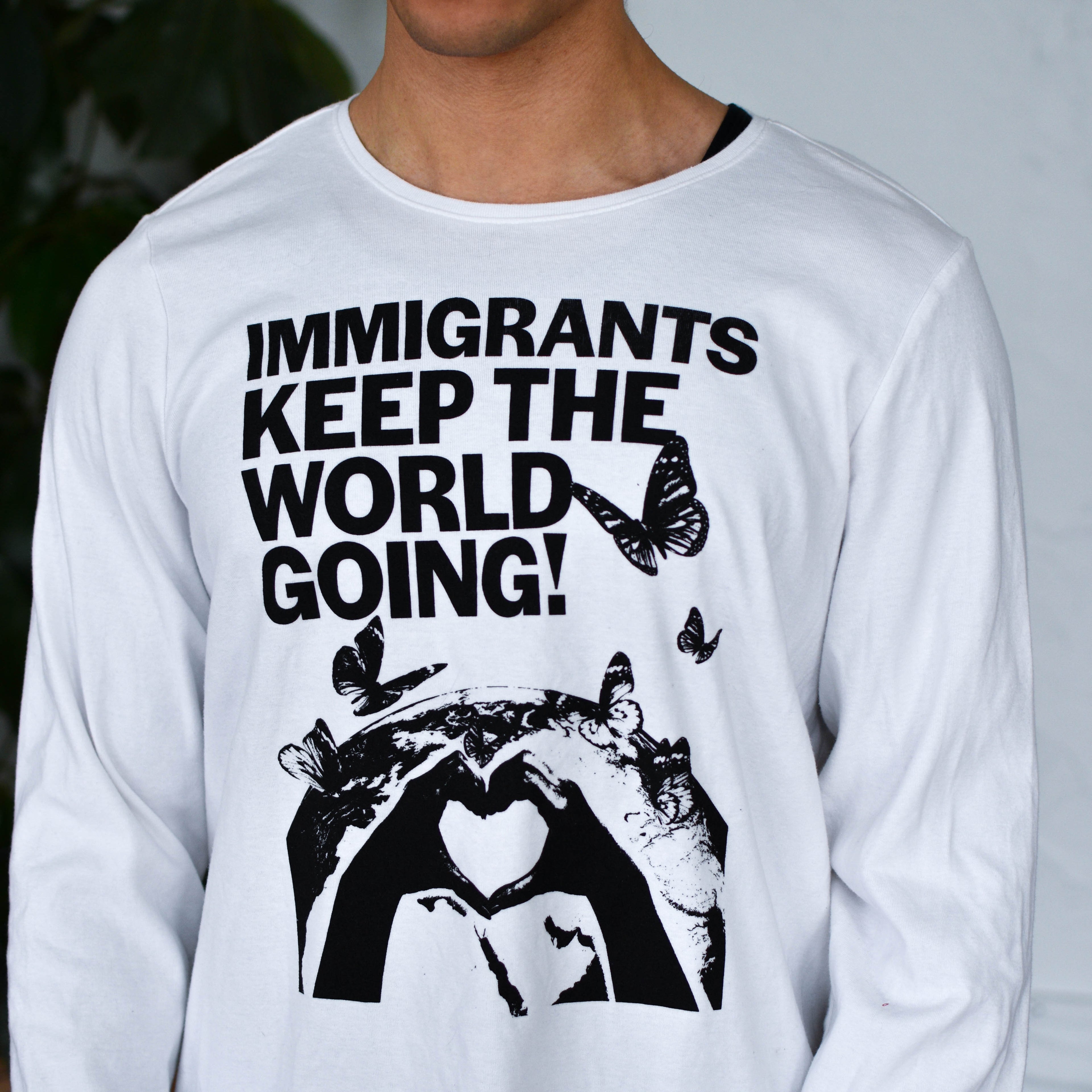 White Longsleeve Shirt - "Immigrants Keep the World Going" Solidarity Merch