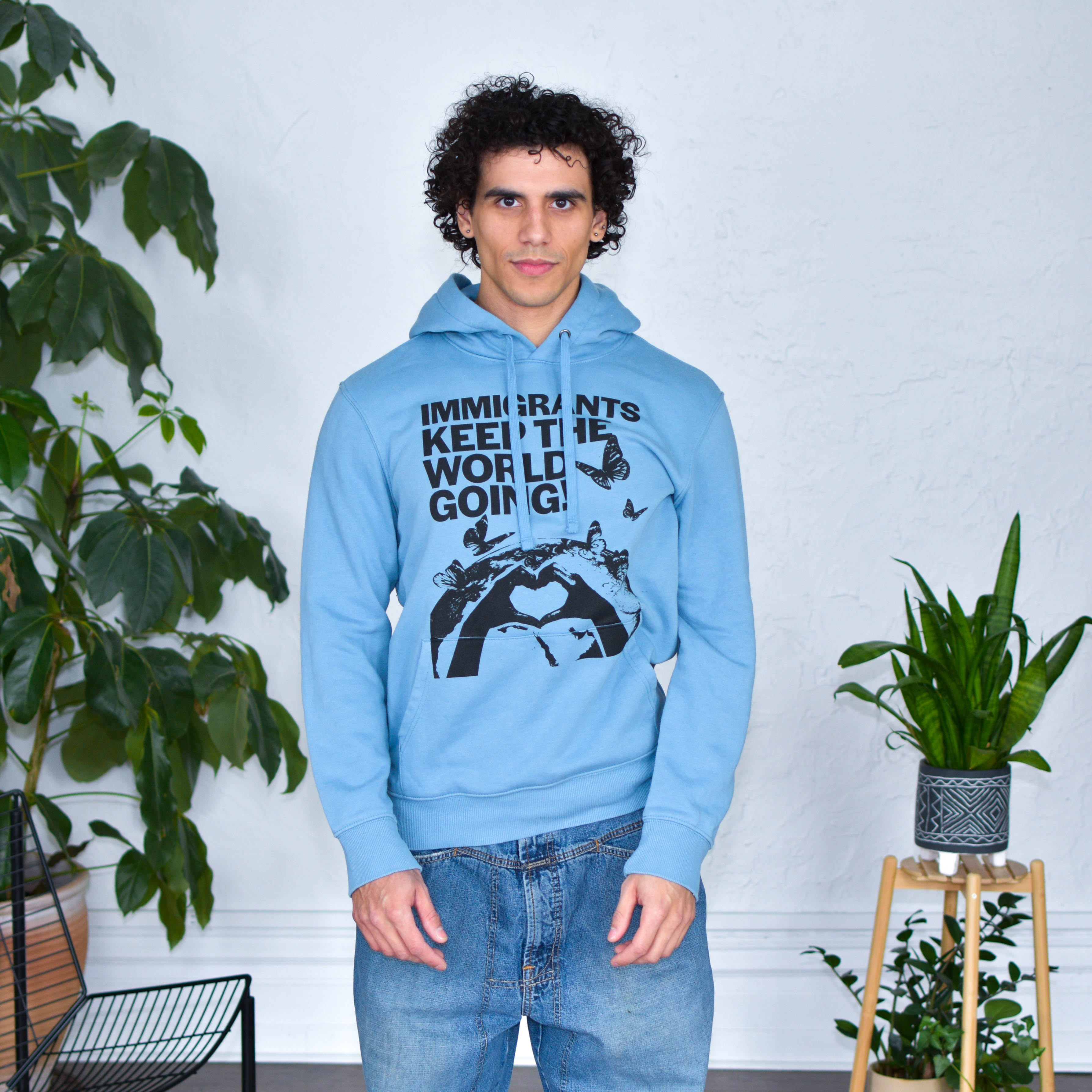 Light Blue Hoodie "Immigrants Keep the World Going" Solidarity Merch