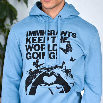 Light Blue Hoodie "Immigrants Keep the World Going" Solidarity Merch