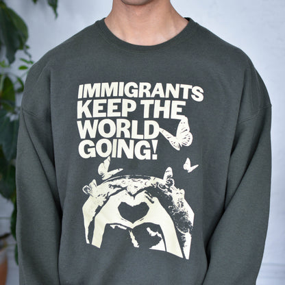Green Sweatshirt "Immigrants Keep the World Going" Solidarity Merch