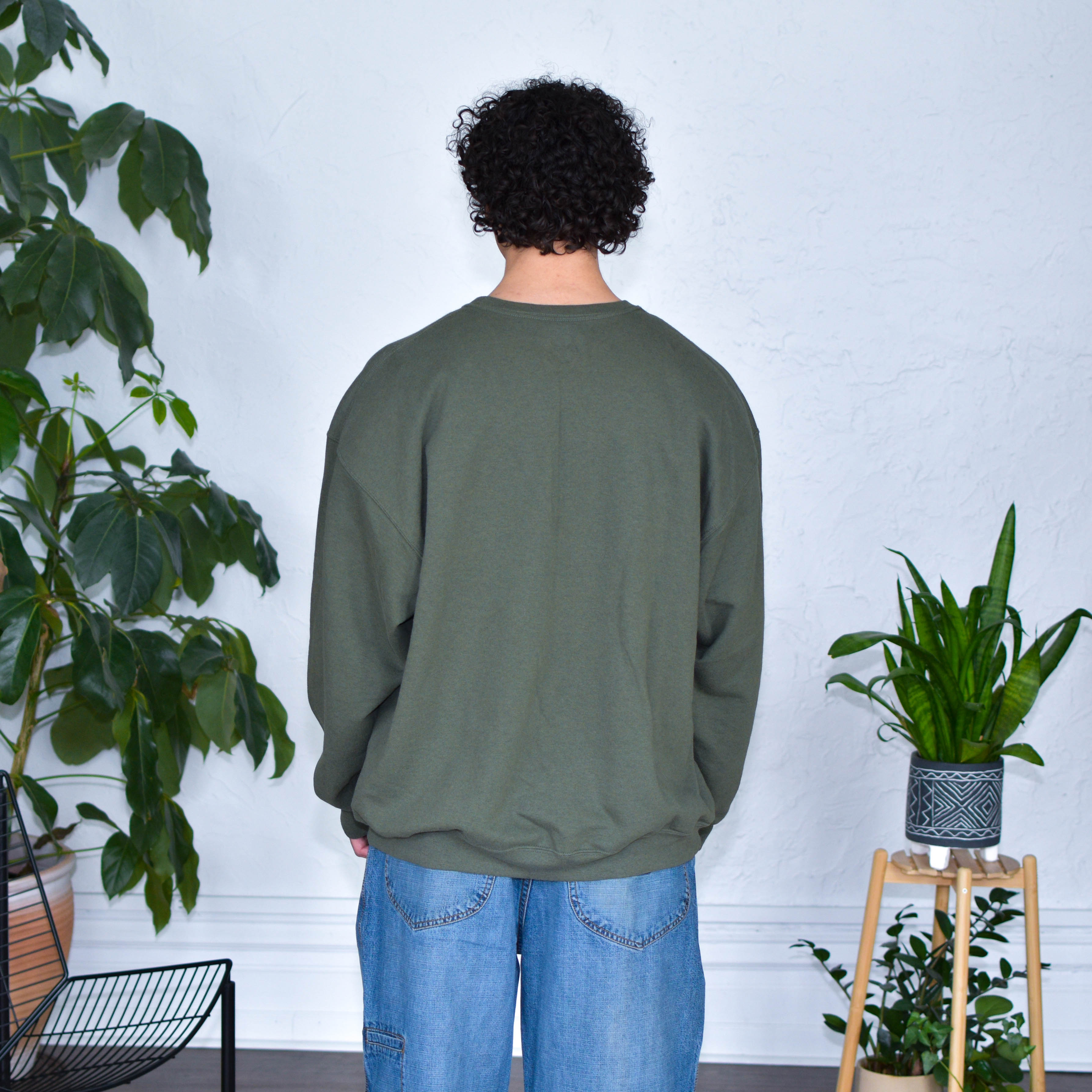 Green Sweatshirt "Immigrants Keep the World Going" Solidarity Merch