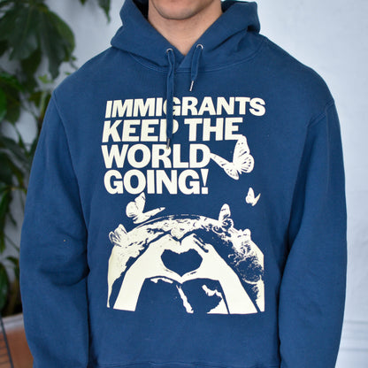 Blue Hoodie "Immigrants Keep the World Going" Solidarity Merch