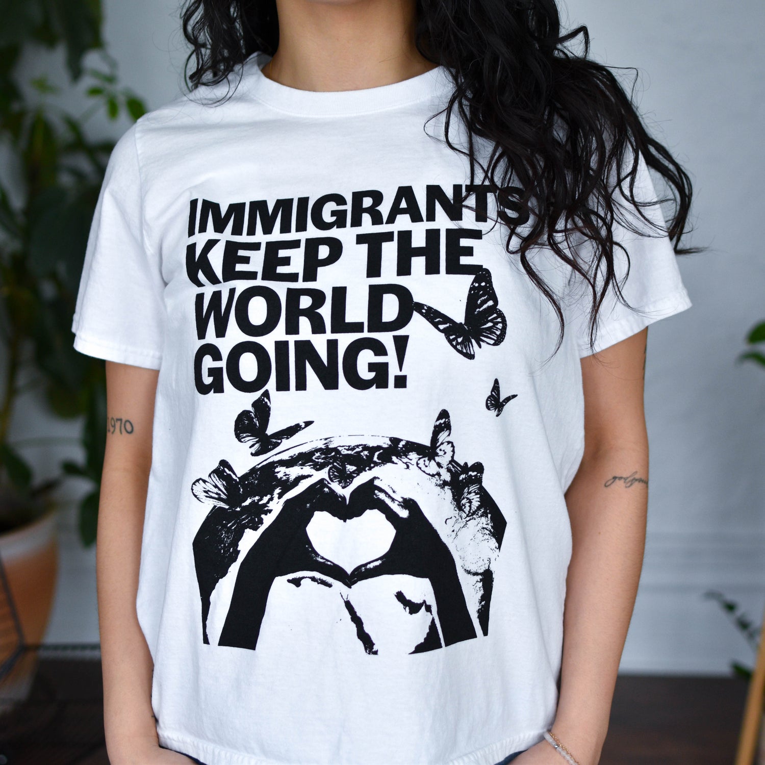 White T-Shirt - "Immigrants Keep the World Going" Solidarity Merch