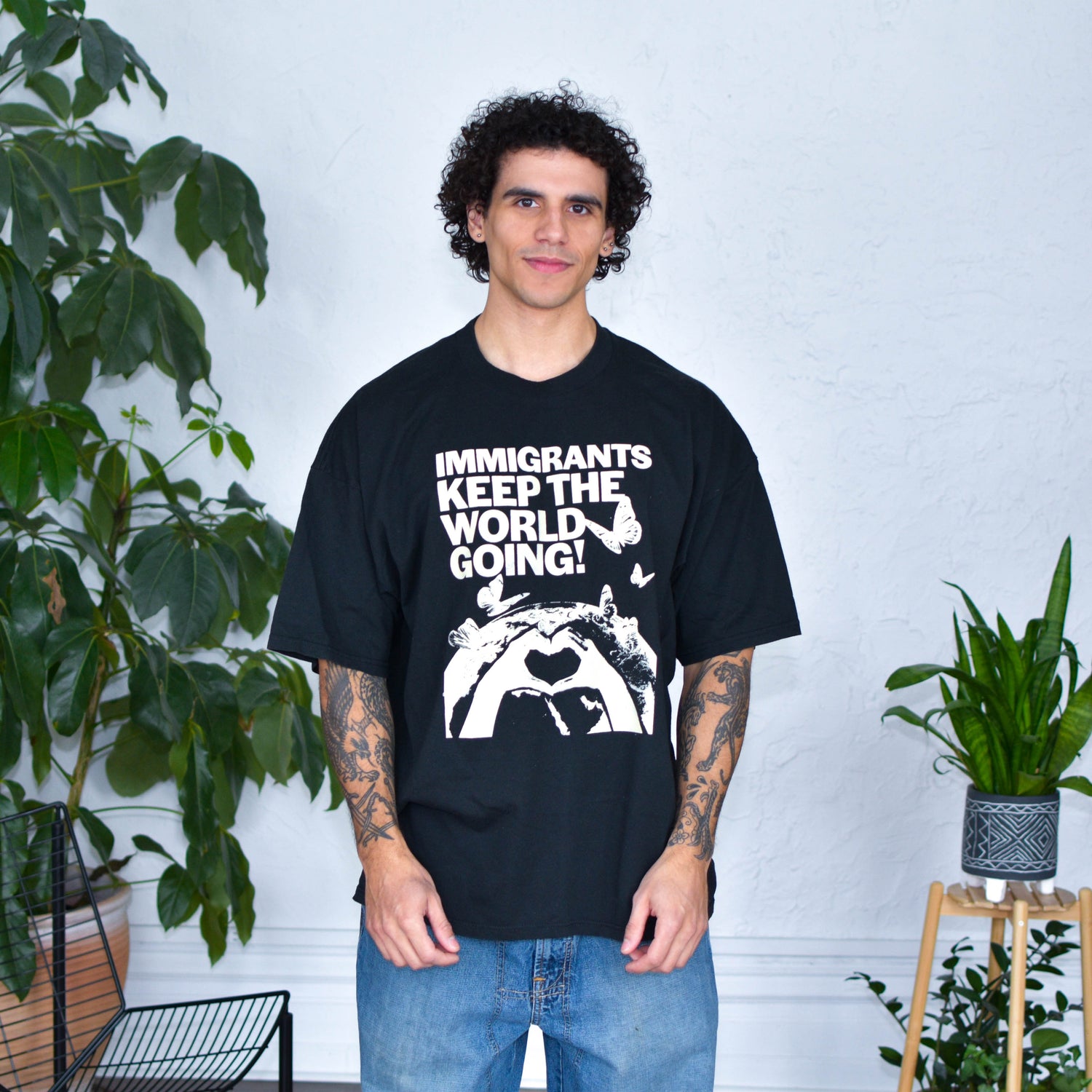 Black T-Shirt - "Immigrants Keep the World Going" Solidarity Merch