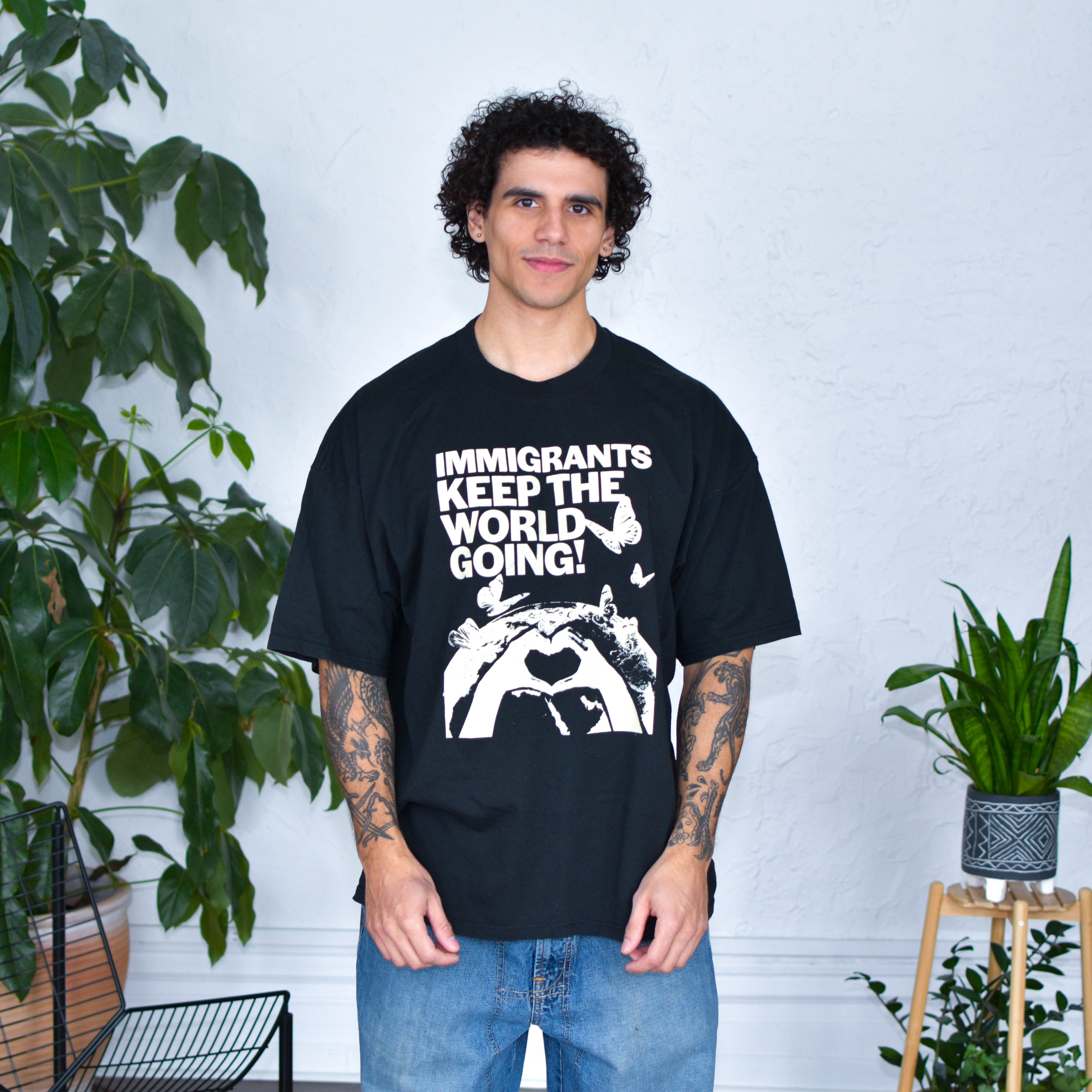 Black T-Shirt - "Immigrants Keep the World Going" Solidarity Merch