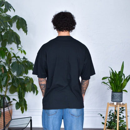 Black T-Shirt - "Immigrants Keep the World Going" Solidarity Merch