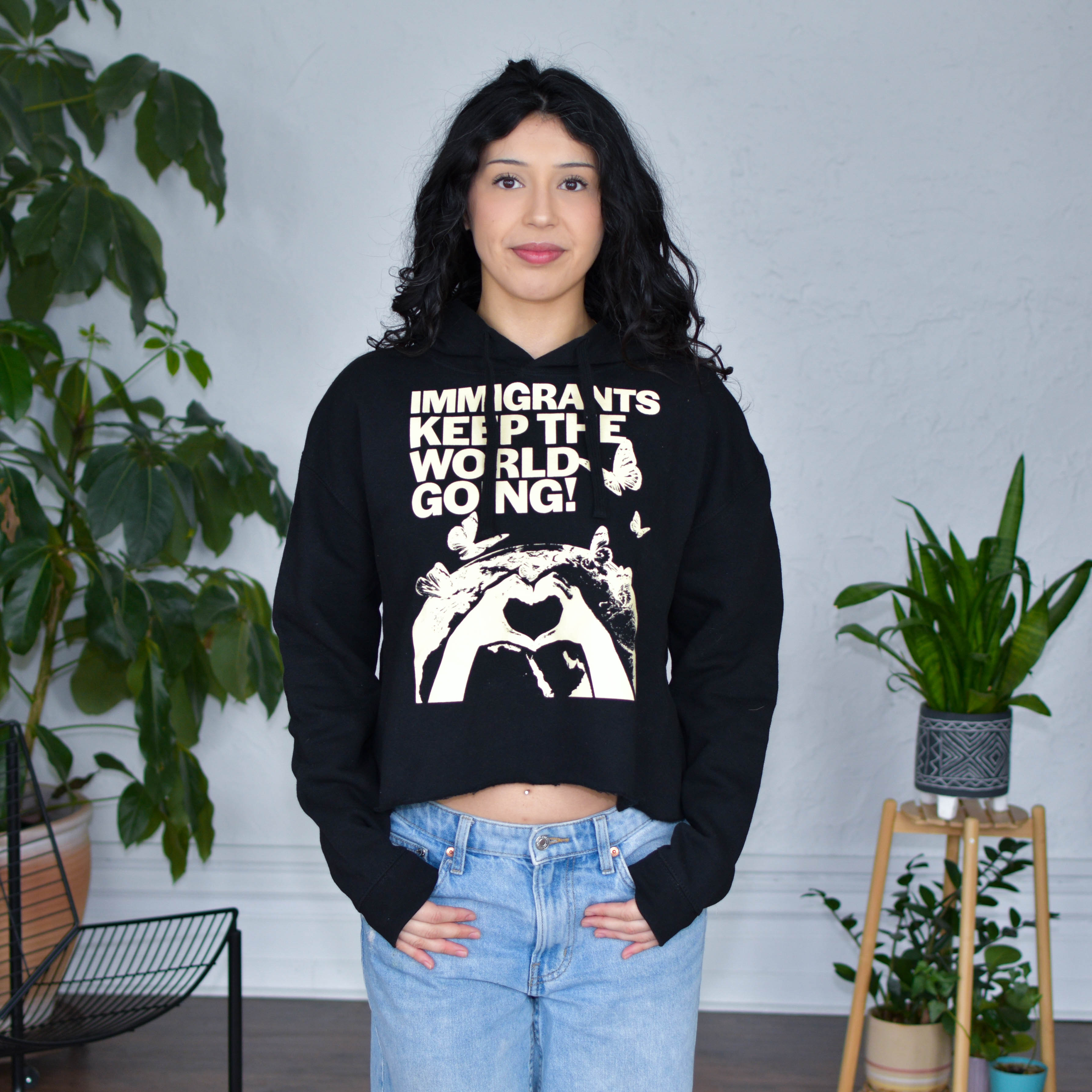 Black Cropped Hoodie "Immigrants Keep the World Going" Solidarity Merch