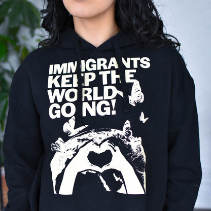Black Cropped Hoodie "Immigrants Keep the World Going" Solidarity Merch