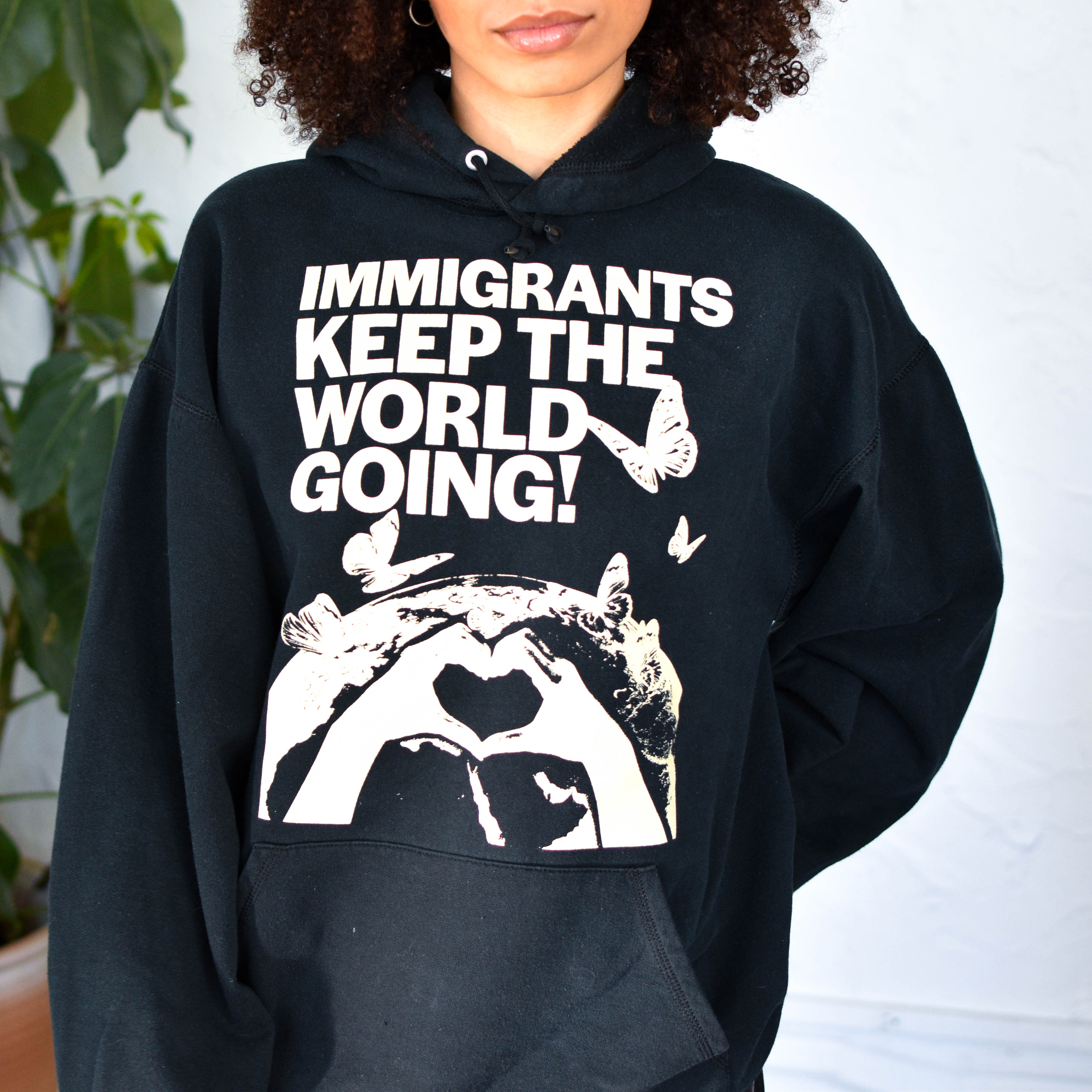 Black Sweatshirt - "Immigrants Keep the World Going" Solidarity Merch