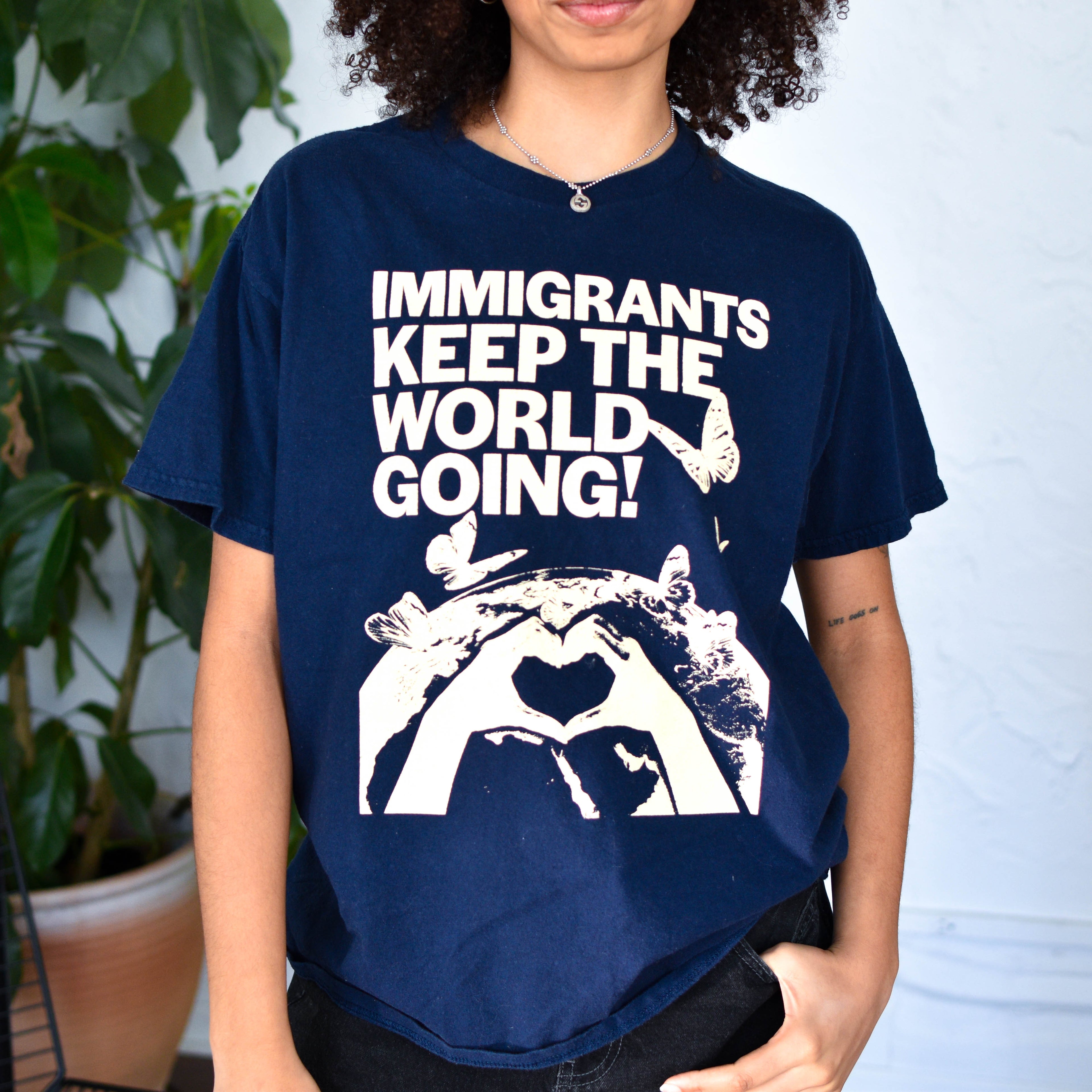 Navy T-Shirt - "Immigrants Keep the World Going" Solidarity Merch