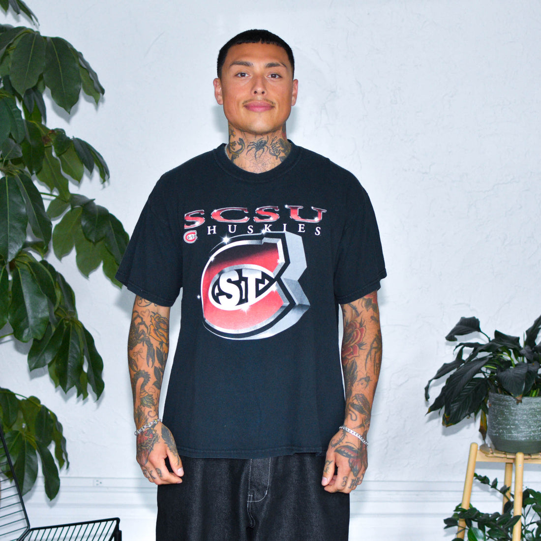 Model Wearing Vintage St. Cloud State University Black Graphic T-Shirt from Bro Bros Closet