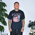 Model Wearing Vintage St. Cloud State University Black Graphic T-Shirt from Bro Bros Closet