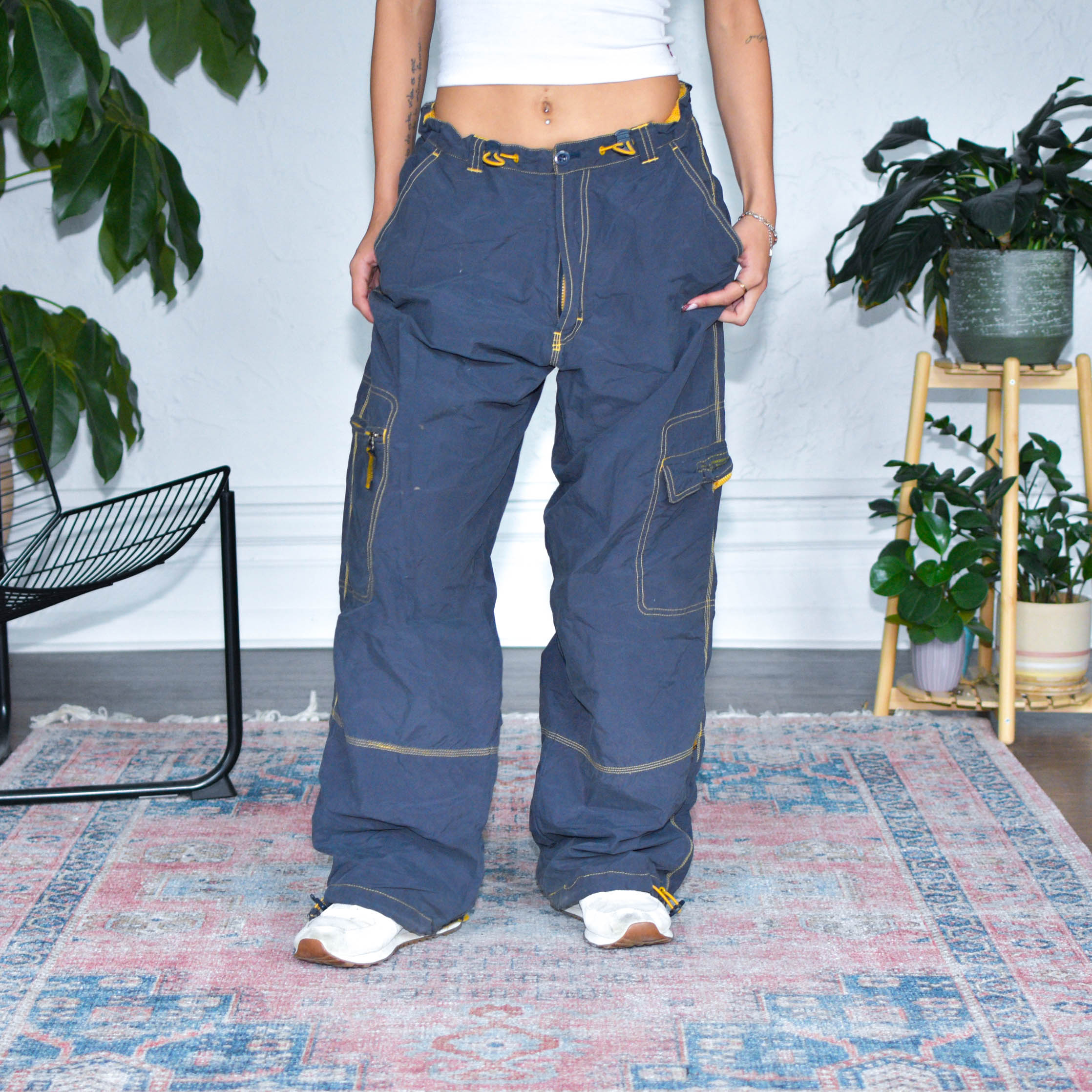 Model wearing Vintage Y2K Breakdown Navy and Yellow Nylon Cargo Pants